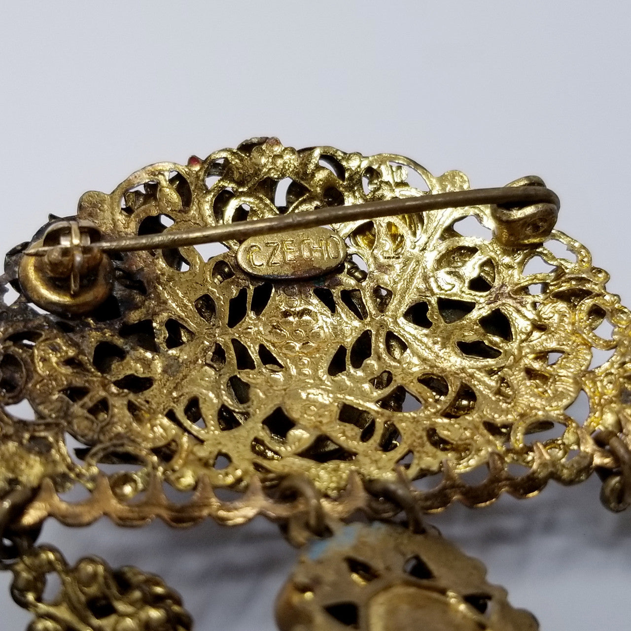 Vintage Czech Dangling Ornate Brooch with Crystals and Floral Enameling in Gold Tone