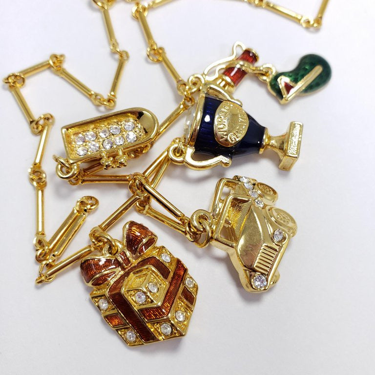 Kenneth Jay Lane Bar Link Charm Necklace in Gold, features Trophy, Car, Golf