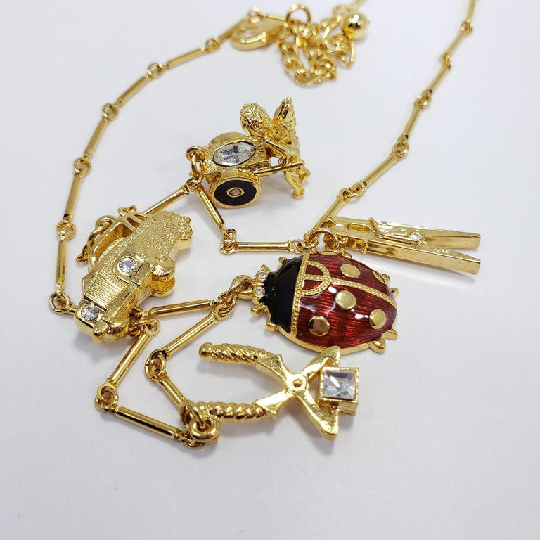 KennethKenneth Jay Lane Bar Link Charm Necklace in Gold, features Ladybug, Car, Angel