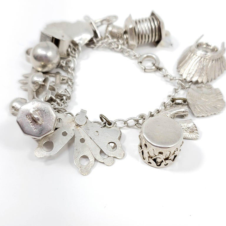 Sterling Silver 19 Charm Assortment Chain Bracelet, Mid 1900s, Mexico