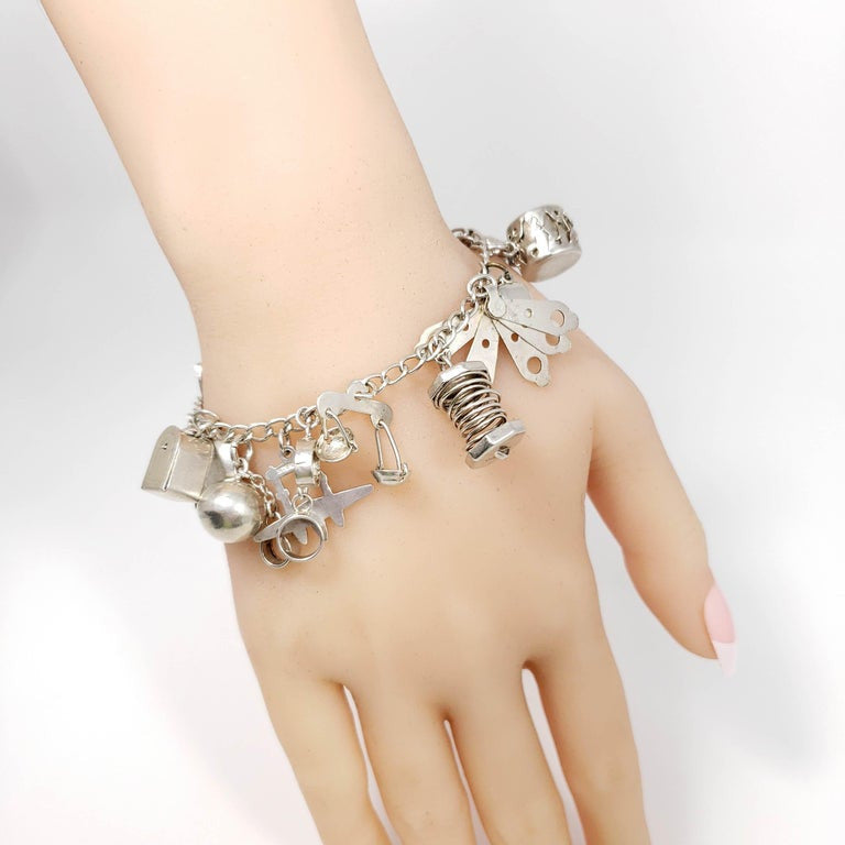 Sterling Silver 19 Charm Assortment Chain Bracelet, Mid 1900s, Mexico