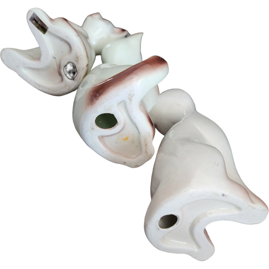 Three Stylized Porcelain Cat Figurines Each with Distinct Pose