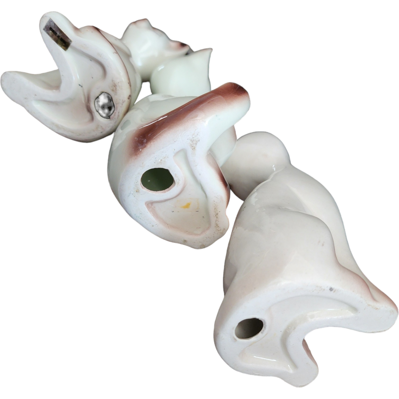 Three Stylized Porcelain Cat Figurines Each with Distinct Pose